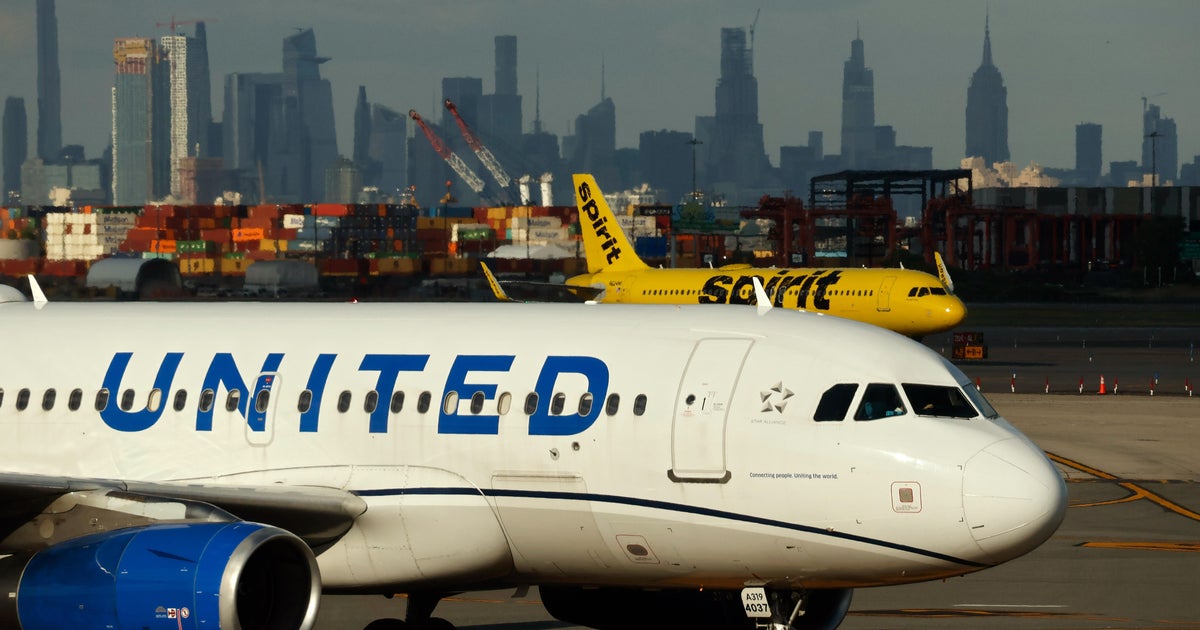 United Airlines cutting 35 flights per day from Newark Airport as problems persist - CBS News