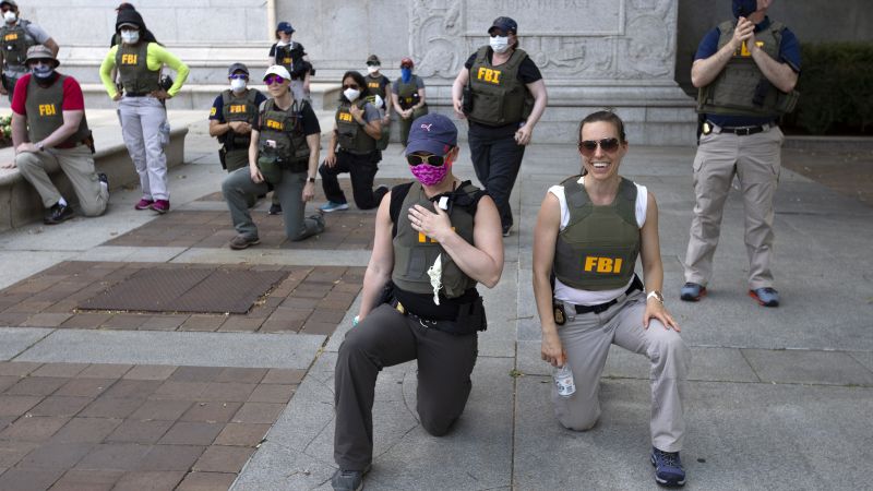 FBI fires agents seen kneeling in iconic photo during George Floyd protests five years ago | CNN Politics