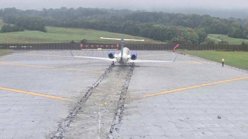 First officer twice tried to stop botched landing before plane skidded off the end of the runway, NTSB says | CNN