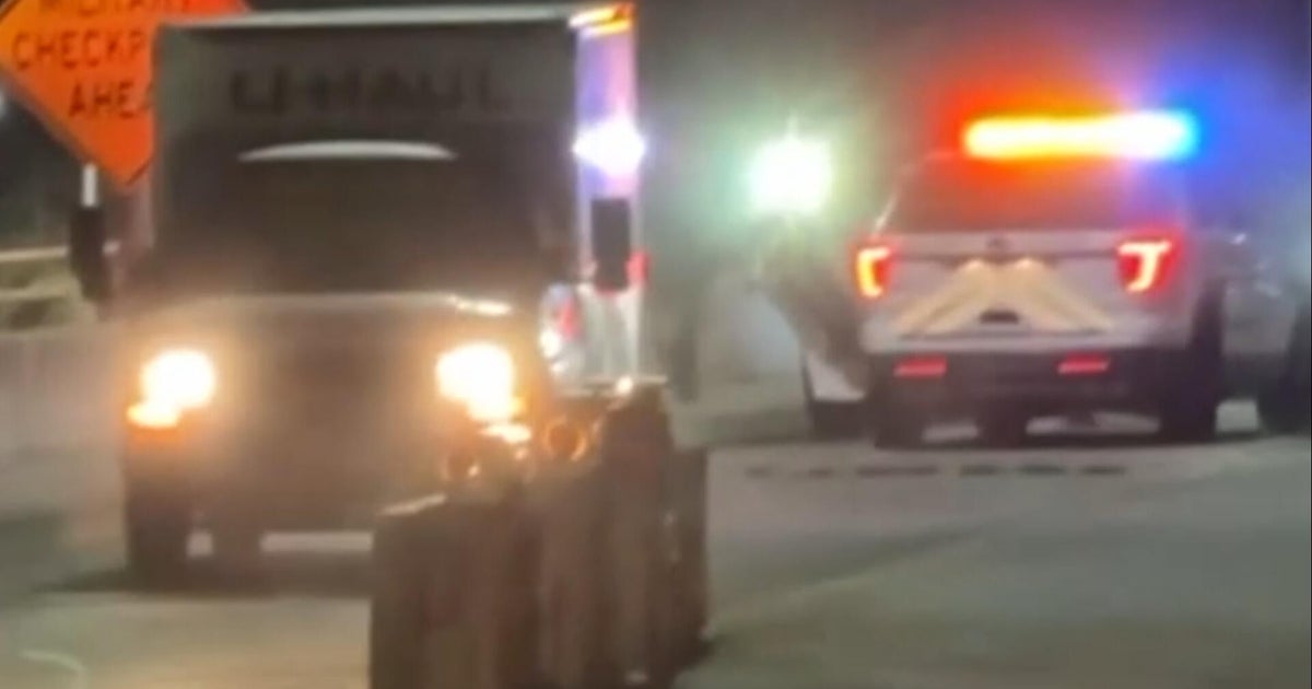 Witness describes tense scene as officers shot at U-Haul during protests - CBS News
