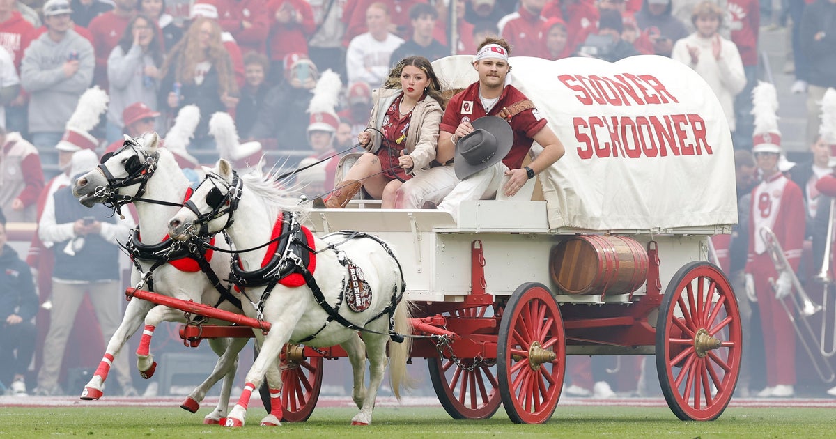 First Native woman drives Oklahoma's iconic Sooner Schooner, a covered wagon mascot - CBS News