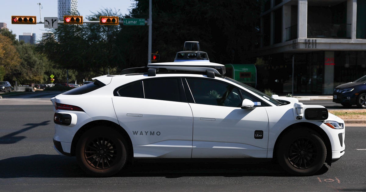 U.S. expands investigation into Waymo over robotaxis driving around stopped school buses - CBS News
