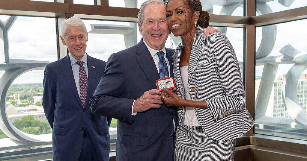 George W. Bush gifts Michelle Obama a tin of Altoids at Obama Center opening in an ode to their friendship - CBS News